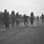 A young boy plays football on a road at an IDP camp near the town of Jowhar, Somalia, on December 14.